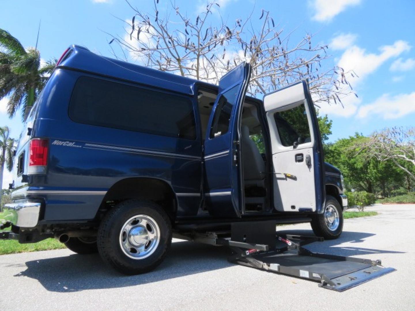 2011 Dark Blue /Gray Ford E-Series Wagon E-350 XLT Super Duty (1FBNE3BS4BD) with an 6.8L V10 SOHC 20V engine, located at 4301 Oak Circle #19, Boca Raton, FL, 33431, (954) 561-2499, 26.388861, -80.084038 - You are looking at a Gorgeous 2011 Ford Econoline E350 XLT Norcal Max High Top Handicap Wheelchair Conversion Van with 6.8L V10, 15K Original Miles, 9 Inch Lowered Floor, Braun UVL Side Entry Wheelchair Lift, Remote Control Power Side Entry Doors, Expanded Side Entry Doors, Q Straint Tie Down, Syste - Photo#51